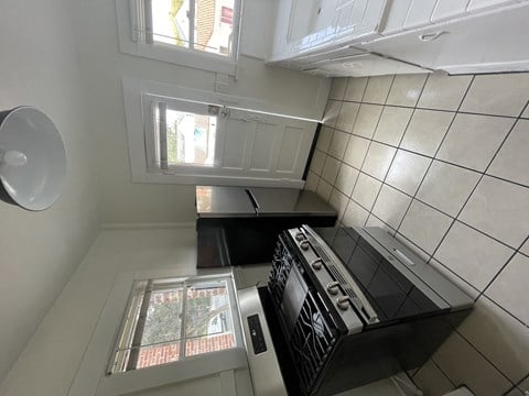 an overhead view of a kitchen with a stove and a window